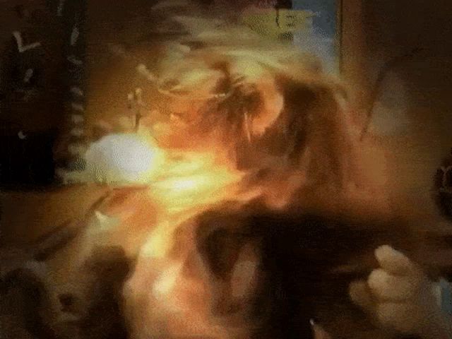 a close up of a person 's face with smoke coming out of it and the letter l visible