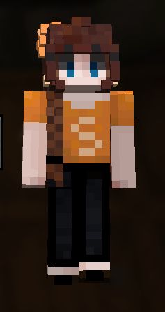 a screenshot of a minecraft character with an orange t-shirt, black pants and shoes and orange flowers in her hair. Her tee has a peach "S" on the front. Her long hair is braided neatly to one side. 