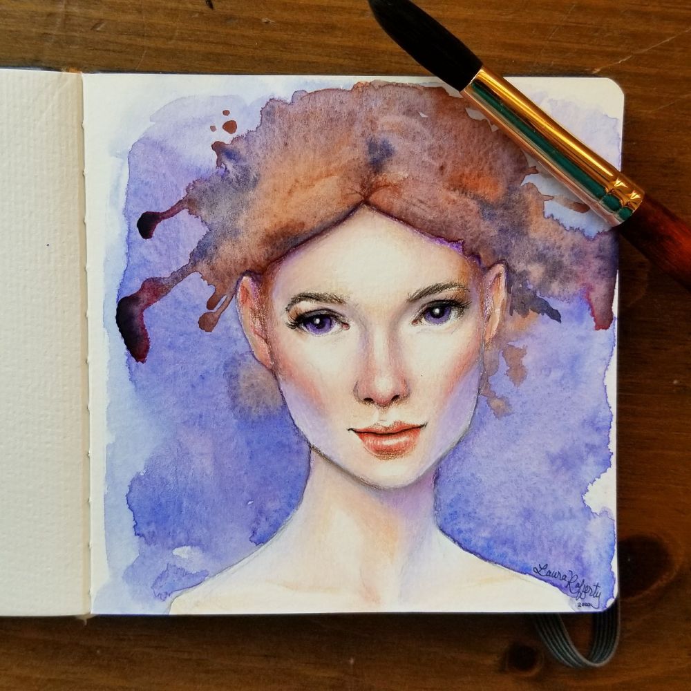 Photograph of a watercolor sketchbook with a portrait of a young woman with watercolor splashes and drips for hair.