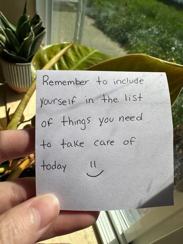 A handwritten sign that says remember to include yourself in the list of things you need to take care of today.