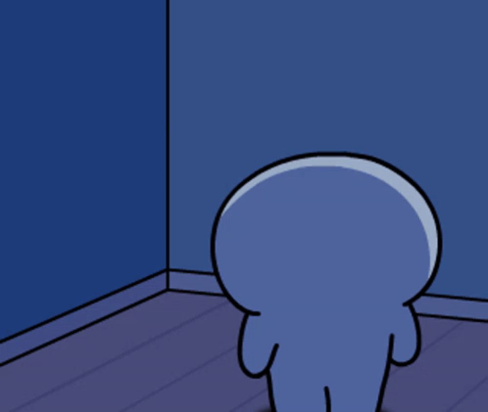 a blue cartoon character standing in a corner of a room