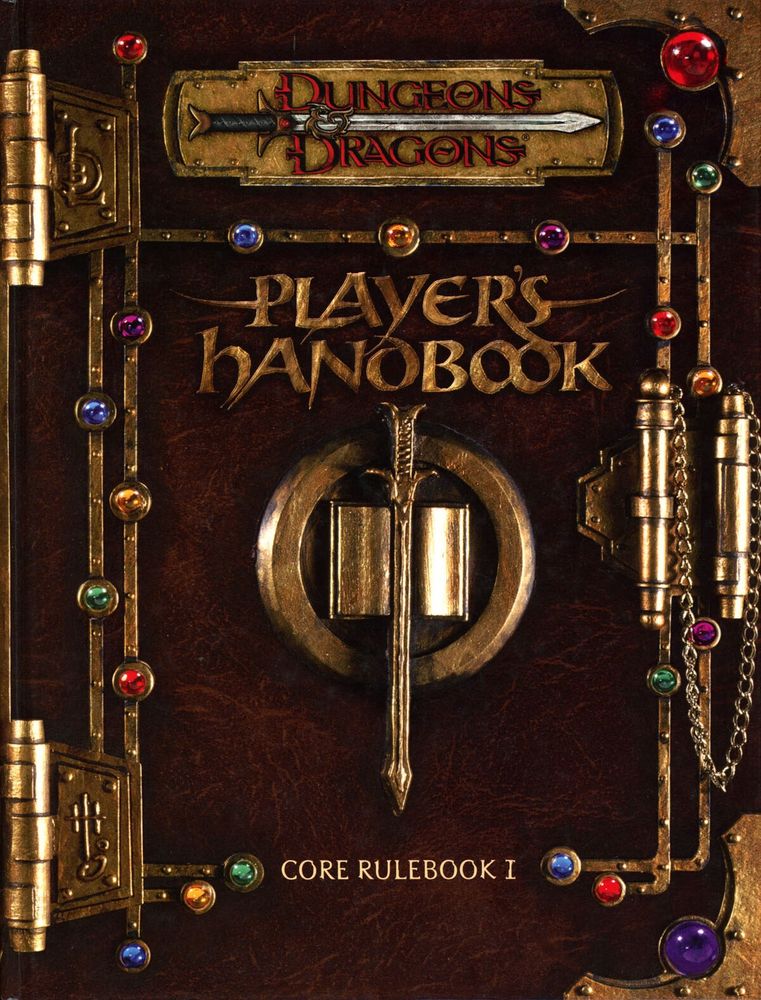 The cover of the 3E Player’s Handbook, designed to look like a gem and gold covered tome. 