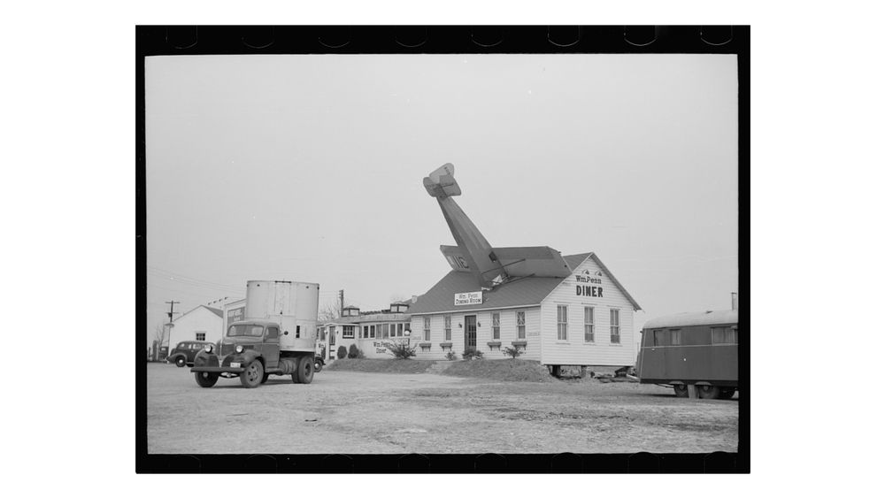 A diner with a plane sticking out of the roof