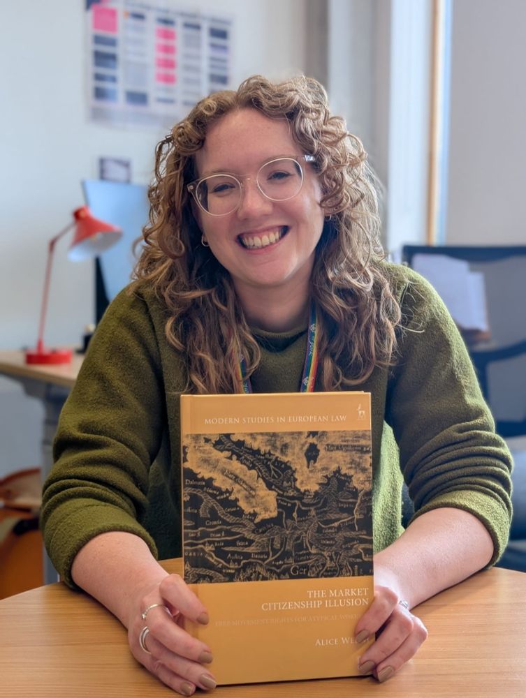 The author holding a copy of the book