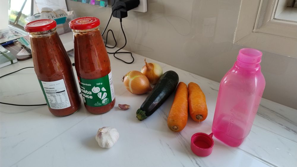 Ingredients for a Bolognese sauce on the bench.