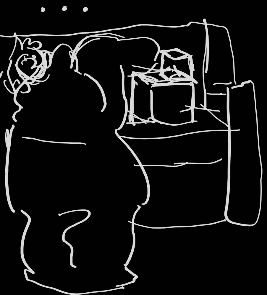 Crudely drawn human curled up with a blanket on a couch. His feet are propped up on some boxes and he cannot bring himself to stand. He is Stuck.