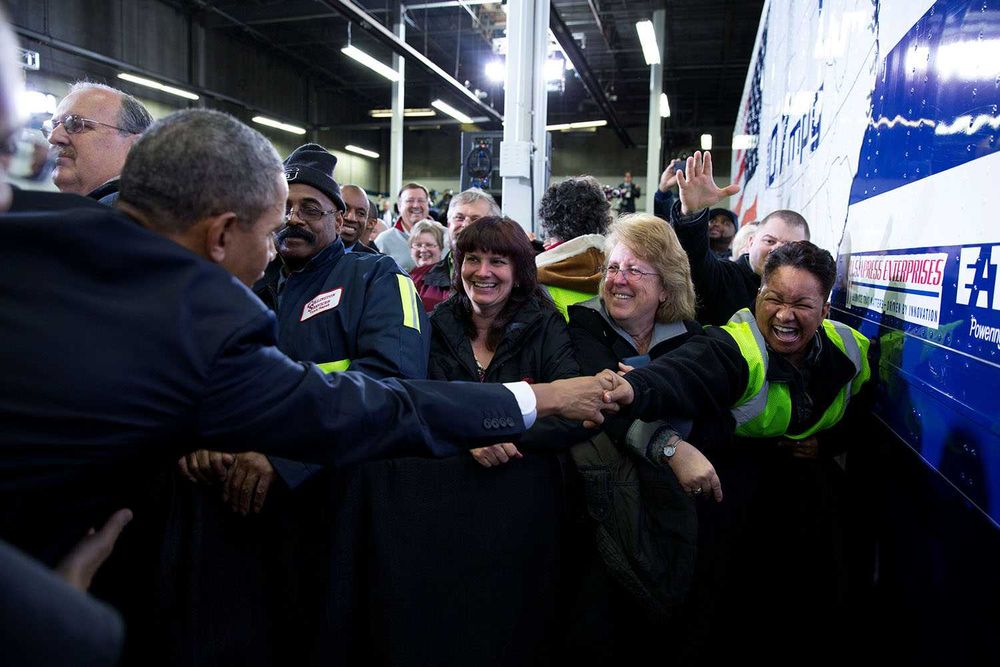 President Barack Obama greets audience members after he delivers remarks on improving the fuel efficiency of American trucks, at the Safeway Distribution Center in Upper Marlboro, Md., Feb. 18, 2014.