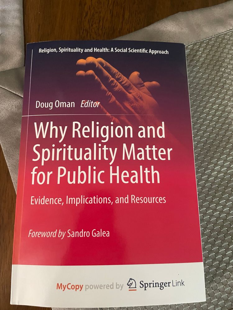 A softcover book on religion and public health. 
