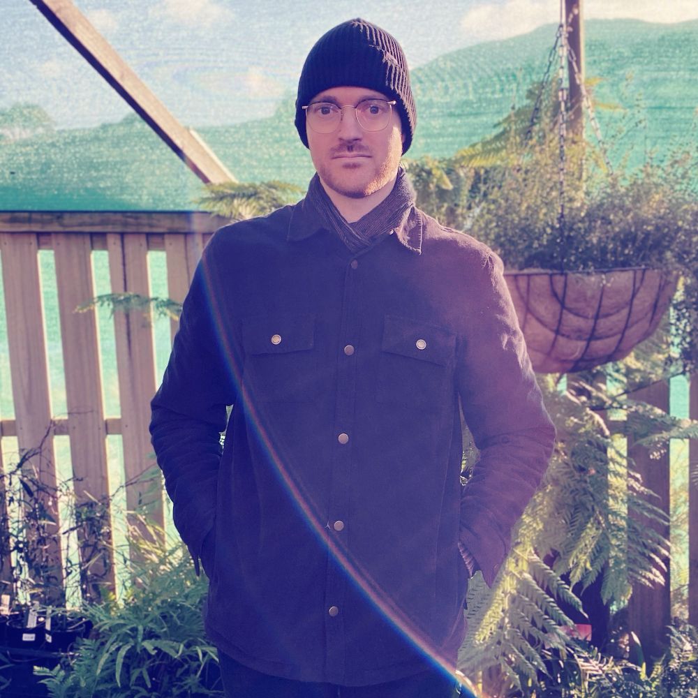 Photo of Spectrical looking at the camera with plants in the background