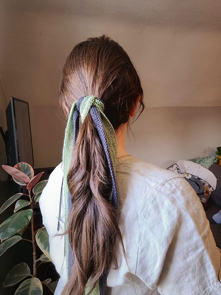 Star Scarf styled by tying it around the base of a ponytail hair style