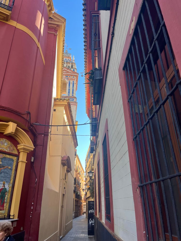 An even narrower and more colorful lane in old town, Seville