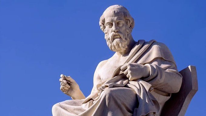 Generic statue of Plato in white marble against a background of blue sky. Nobody knows what he really looked like.