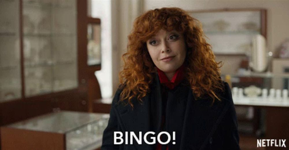 a woman with red hair says " bingo " in a netflix ad