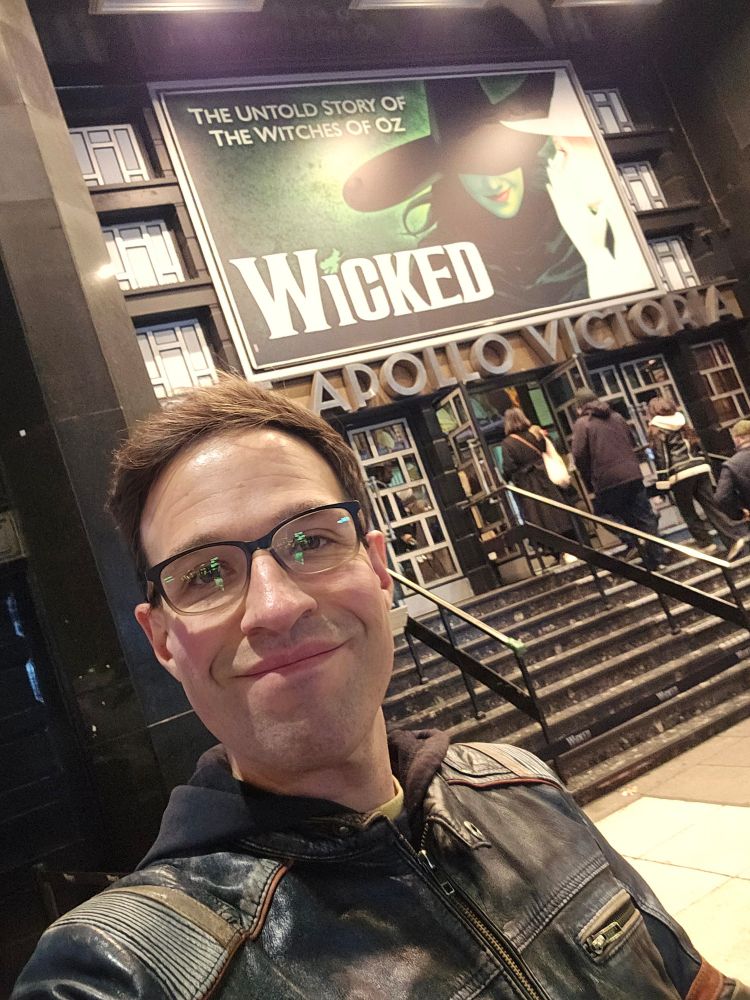 Me standing outside the Apollo Victoria Theatre.