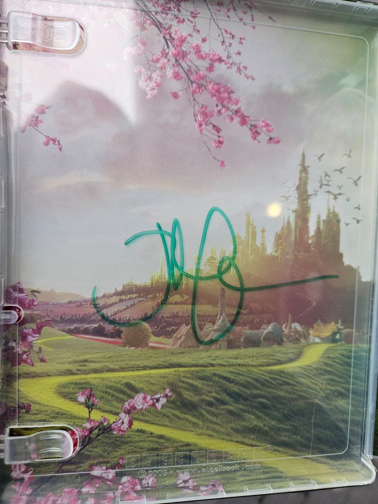 Jon's signature in green over artwork of the Emerald City in my Wicked steelbook.