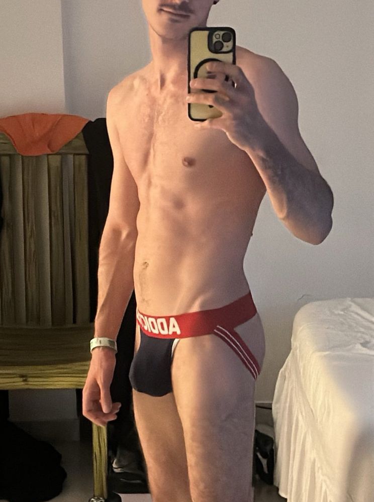 Standing selfie in the mirror, wearing only my addicted red and navy Addicted jockstrap