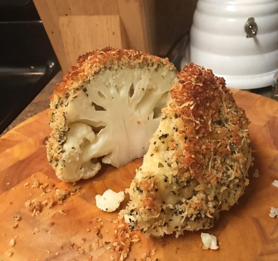 Whole head of cauliflower, roasted and split in half.