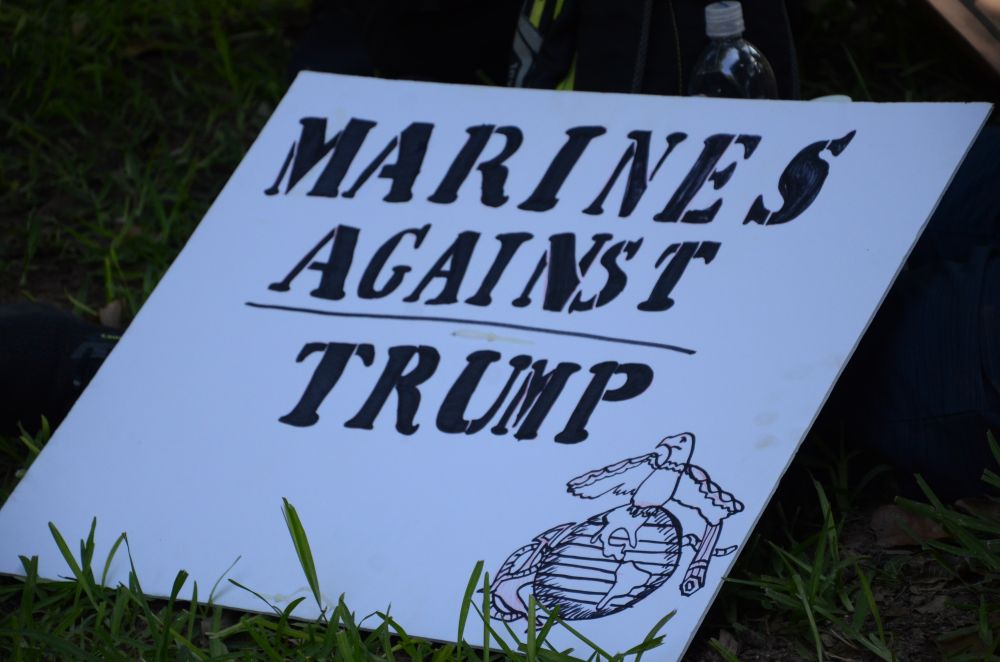 A protest sign at the Austin No Kings rally which reads "Marines Against Trump" with the marine corps logo.
