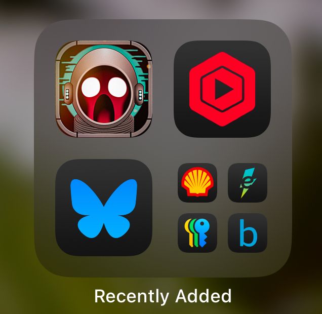 iOS, game icon grouped with other iOS icons on iPhone. 
