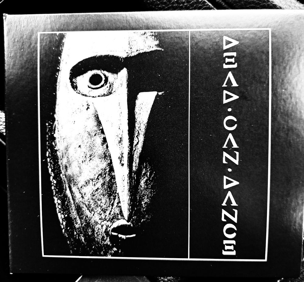 Dead Can Dance album Dead Can Dance. Black and white. Some sort of mask or something 