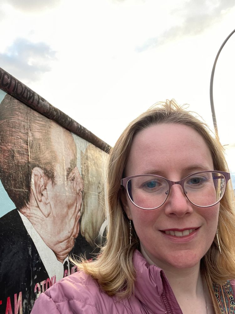 Me in front of the famous East Side Gallery mural of Leonid Brezhnev and Erich Honecker kissing. 