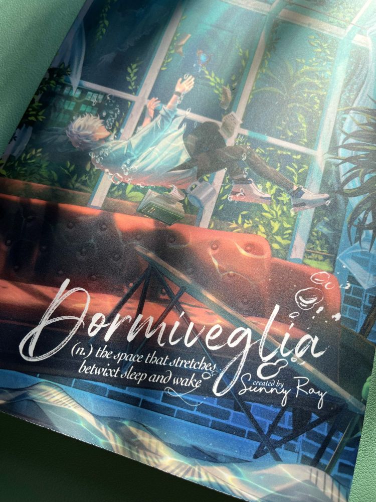 Copy of fanbook "Dormiveglia" dappled in afternoon light. 