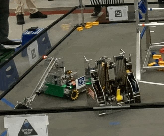 Robot upending another robot 