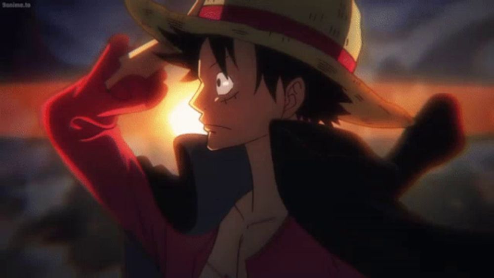 monkey d luffy is wearing a straw hat and a red jacket