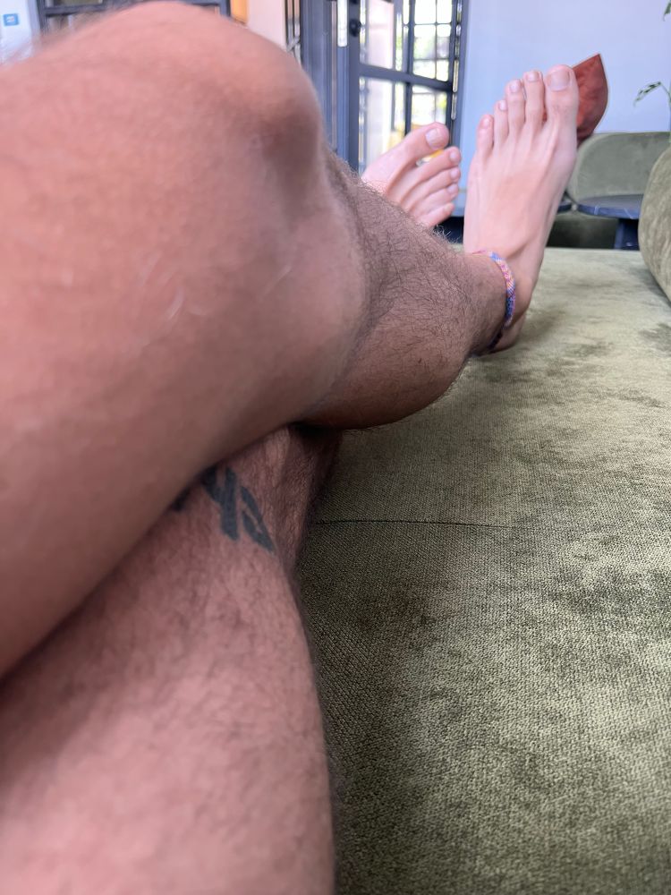 My legs and feet in the sofa