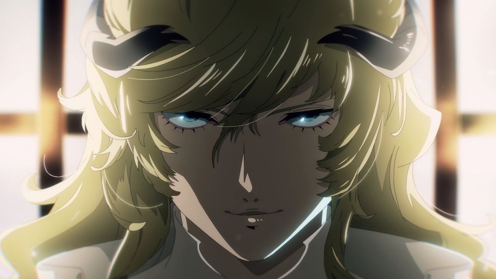 Louis smirking at the camera, he has blue eyes, a slender face with black horns resting on blonde hair