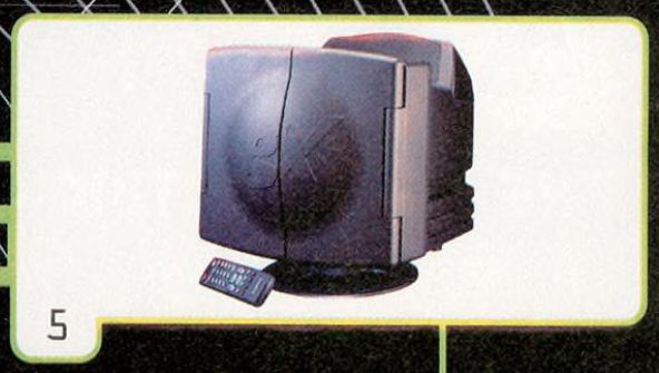 video game tv is currently a closed unit as the speakers fold in over the screen, creating a line down the middle and a bulge at the front with the letters 'gx' etched into the bulge. a remote is sitting in front.