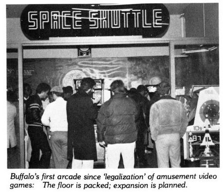 black and white photo of a crowded entrance to an arcade with a multi-white-lined sign above that reads 'space shuttle' in a futuristic font.
caption: buffalo's first arcade since 'legalization' of amusement video games: the floor is packed; expansion is planned.