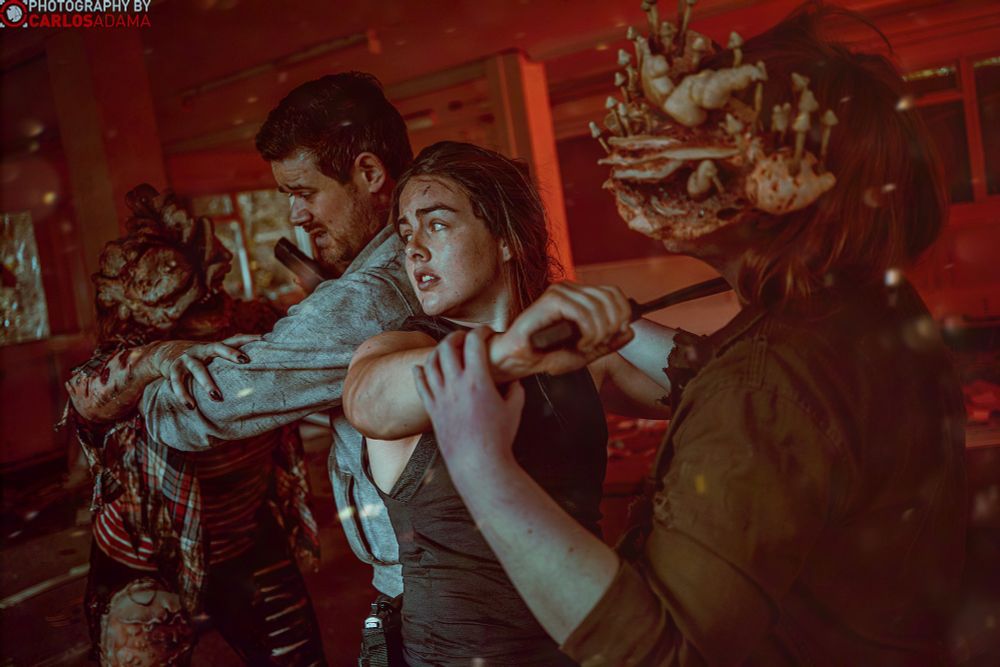 Nieke and Scott are cosplaying Abby and Own. They are holding off two clickers (Hattie and Clara)