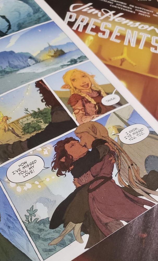 Photograph of a comic page; Onica and Tavra from The Dark Crystal Age of Resistance kissing