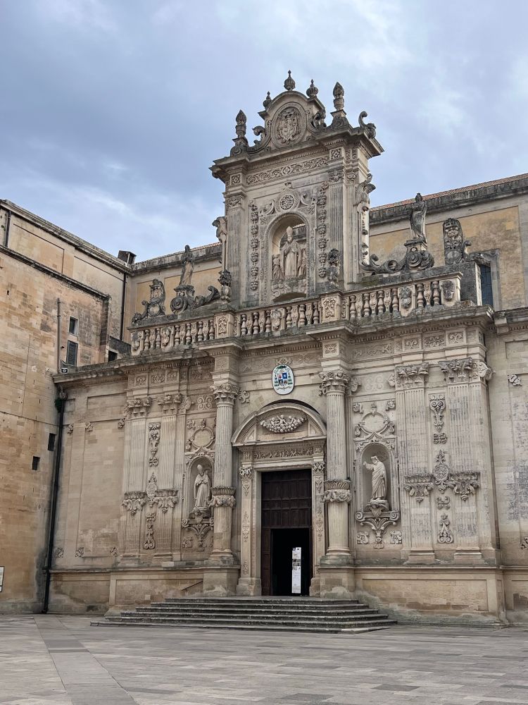 Entrance to a church, in beige stone. It is impossible to describe the level of curlicues, statues, niches, carvings and totally over-designed decorations. It’s called Leccese Baroque. Amazing. 