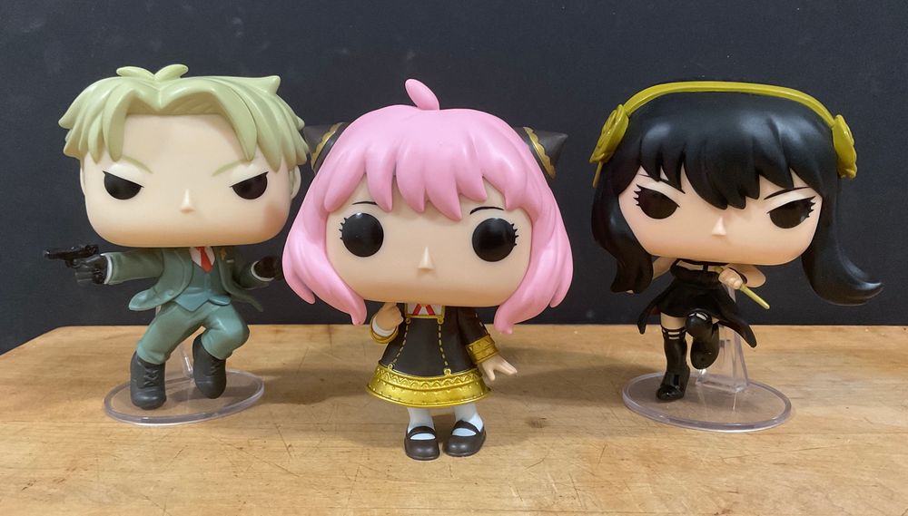 Funko pops of Loid, Anya, and Yor Forger.
