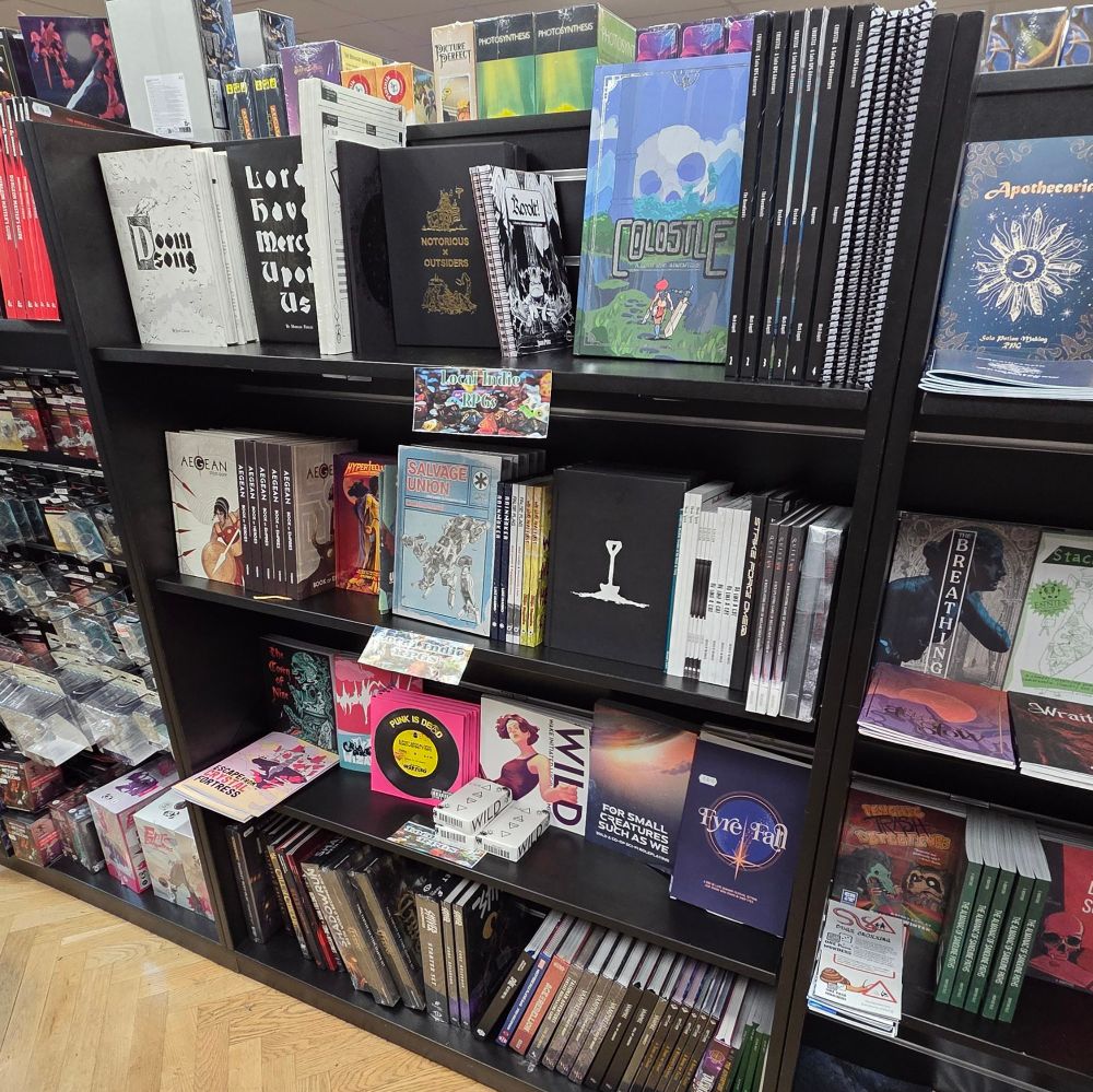 A shelf full of great indie TTRPG books.