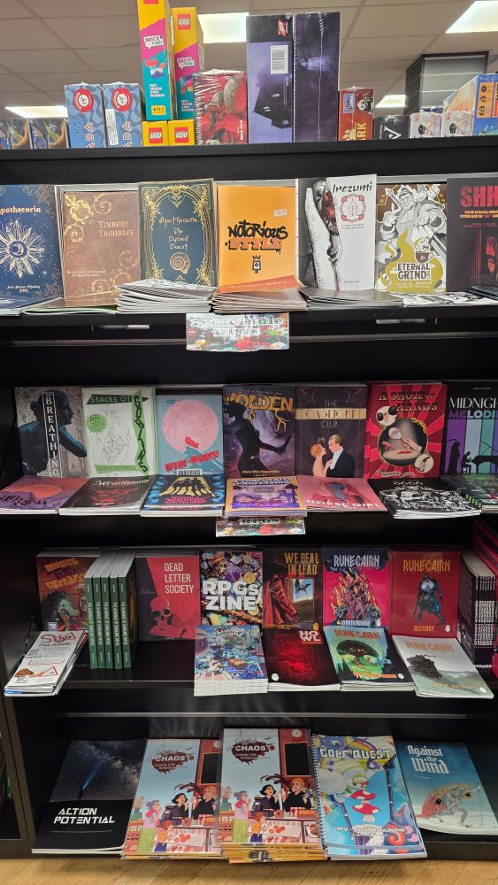 A shelf full of great indie TTRPG books.