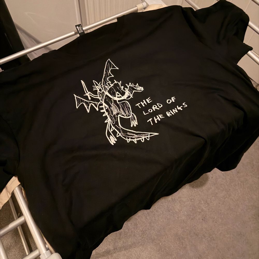 Black shirt with a rough sketch of the Witch King of Angmar riding its horrific mount