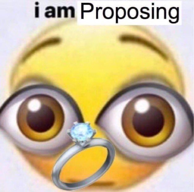 A smiley face with a ring that says I am proposing at the top