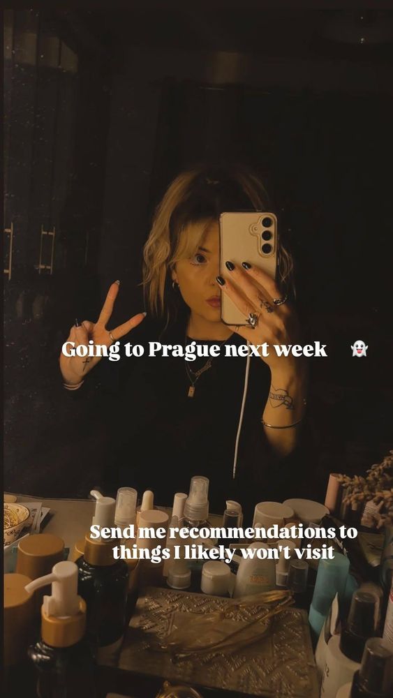 A mirror selfie, with writing over the top. 