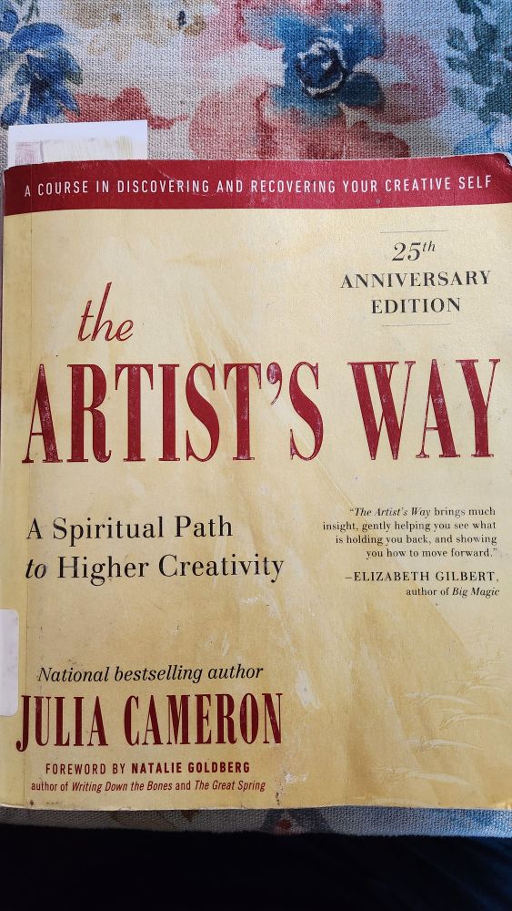 Yellow and crimson library book cover titled- the Artist's Way: A Spiritual Path to Higher Creativity by Julia Cameron 