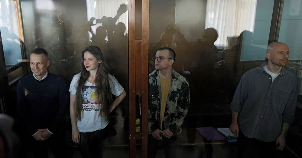 Behind closed doors, Russia tries four journalists for links to Navalny team