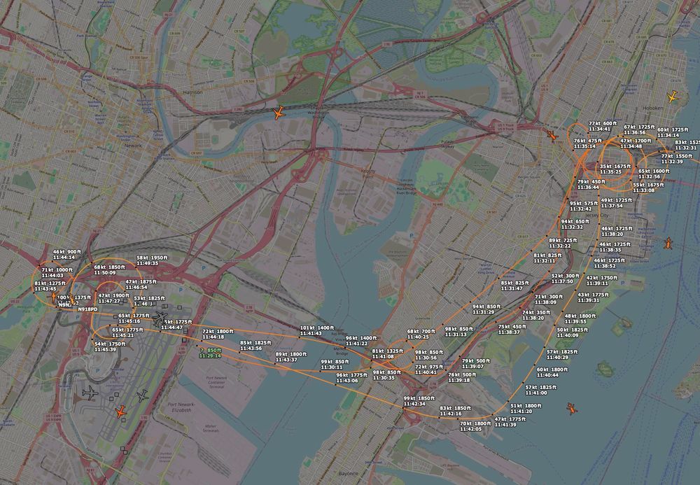 adsb.fi track of N9NJ and N918PD following the turnpike from the Holland Tunnel to EWR, with loops at different points.