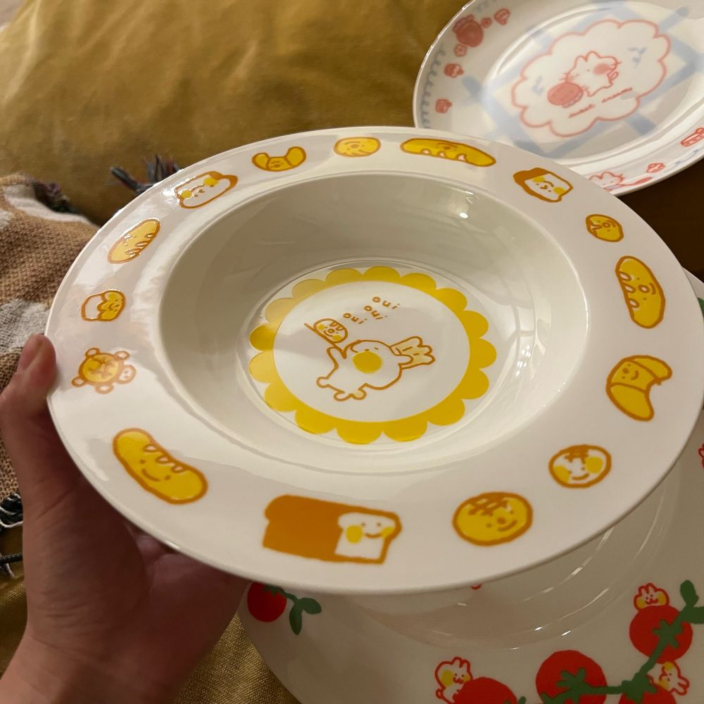 a pasta bowl with drawings of bread on it