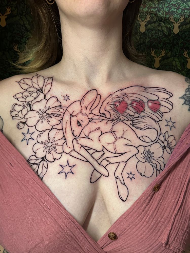 Linework of a chest tattoo cover up, a young fawn unicorn with wings, surrounded by flowers