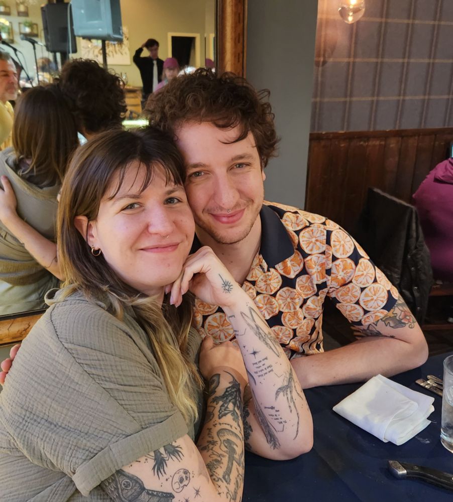 A photo of me and my partner at a restaurant