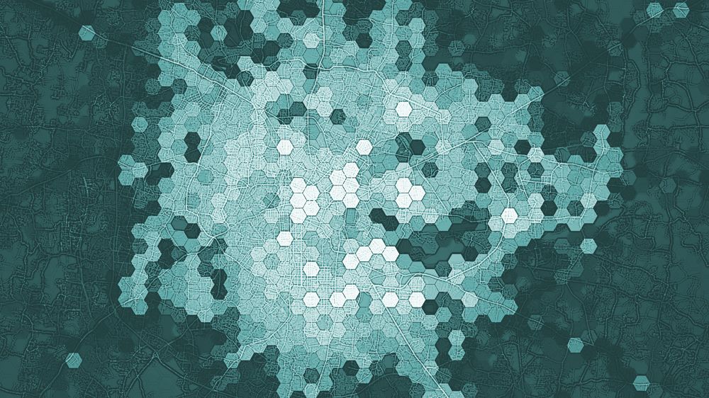 blue/turquoise hexagons over a street network in bengaluru - the lighter the hexagons the more 'places', based on overture map data - highlighting areas with high points of interest density