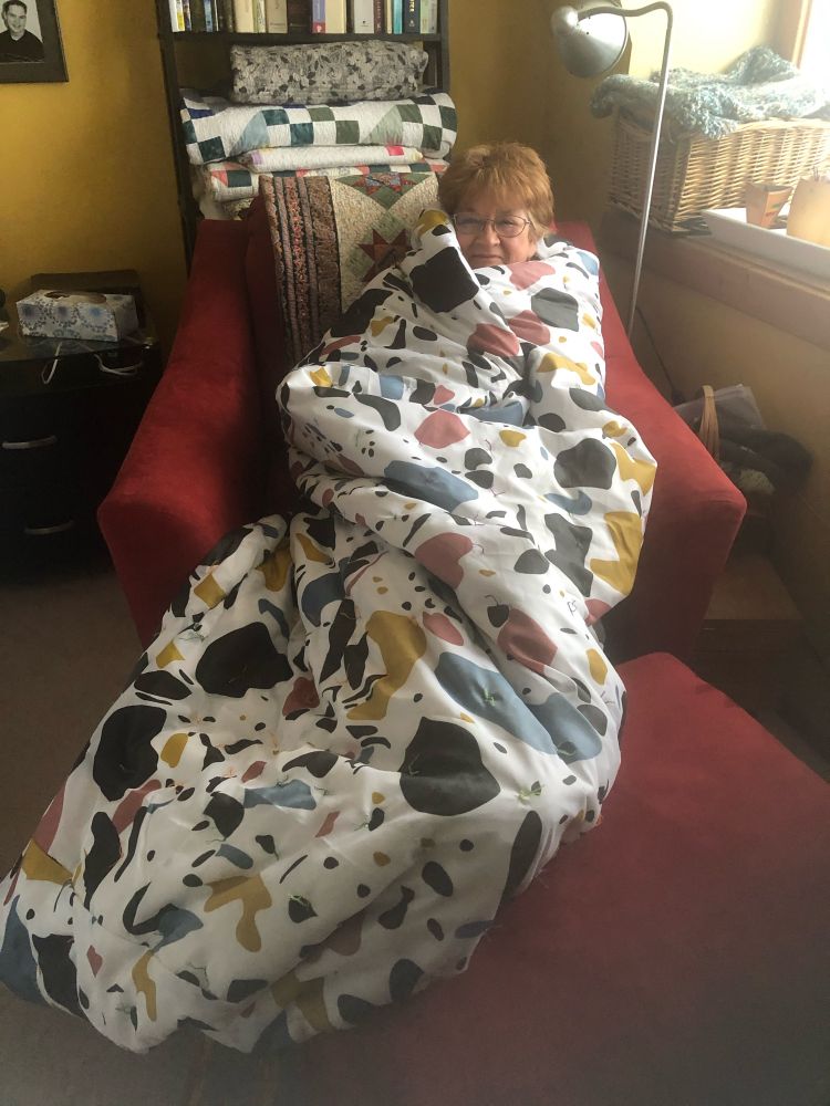Woman wrapped in ‘ugly quilt’ sleeping bag made for those sleeping rough.