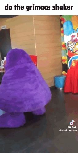 a purple mcdonald 's mascot is dancing in a room with the caption do the grimace shaker